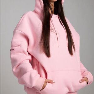 Women's Pink Oversized Hoodie with Zip Sleeve Pocket